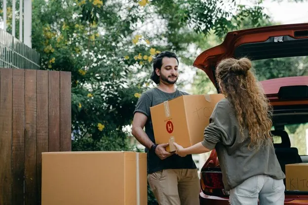 Car culture isolation happens when people feel stuck without a car A couple unloading their things