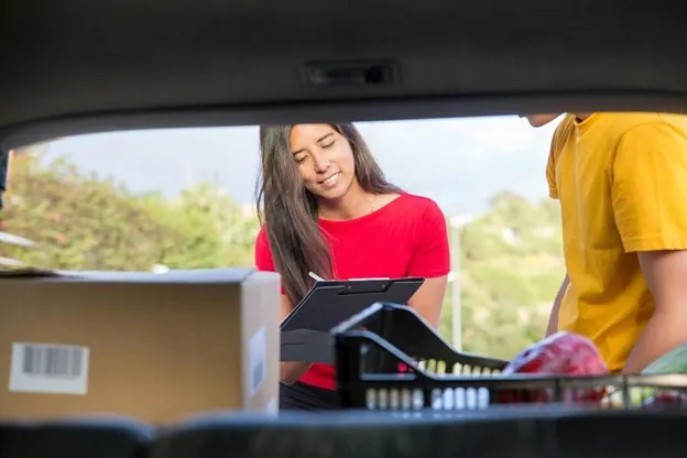 Car culture isolation is a real challenge for expats in North Carolina A couple checking their things in a car trunk