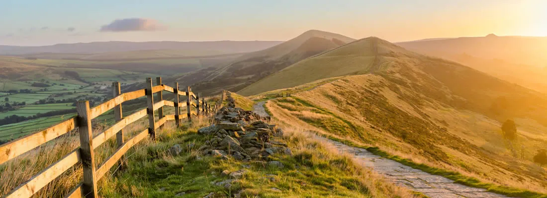 Derbyshire upland landscape with a stone wall and walking path