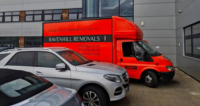 Ravenhill Removals commercial vehicle outside a business property ready for furniture transport