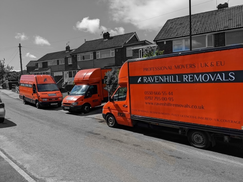 3 moving vans outside a house