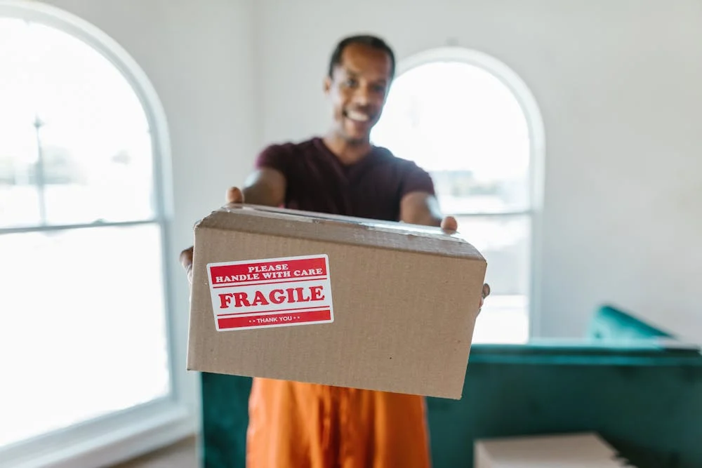 Person holding fragile box