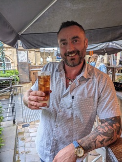 Mark Ravenhill drinking a cocktail