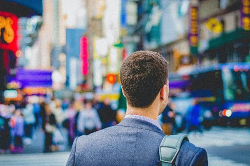 A man walking in a busy town centre