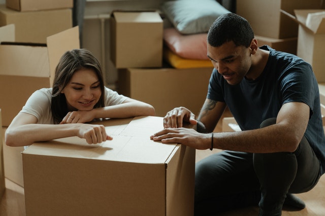 A couple packing for relocation