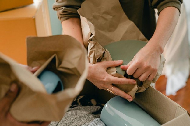 People packing their items for a move